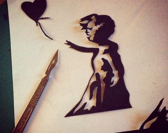 Banksy hand drawn and hand cut paper cutting