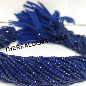 Peut inclure: Un brin de perles de lapis-lazuli bleu foncé, facettées et d'environ 3 mm de diamètre. Les perles sont enfilées sur un fil et sont prêtes à être utilisées pour la fabrication de bijoux.