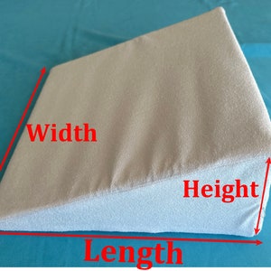 May include: A light gray wedge pillow with measurements labeled "Width", "Length", and "Height".