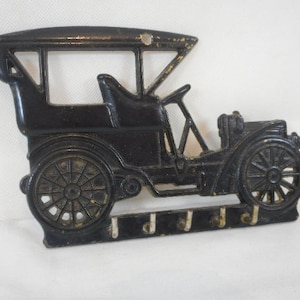 vintage French brass wall mountable key hanger designed as a Car