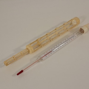 Collectable vintage French Glass thermometer and holder made from plastic