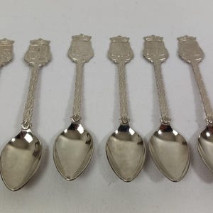 set of six vintage collectable silver plated metal spoons