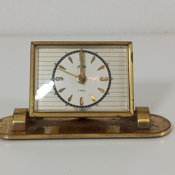 Alte, kleine goldfarbene Manteluhr aus Metall / Messing