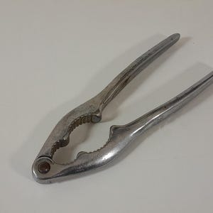 vintage French silver coloured metal nut cracker / kitchenware / tableware