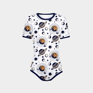 May include: A white bodysuit with a navy blue trim and a pattern of orange and blue planets and stars.