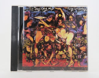 May include: A CD case with a colorful, abstract collage on the front. The text "The Tragically Hip" and "Fully Completely" are printed in white on the front of the case.