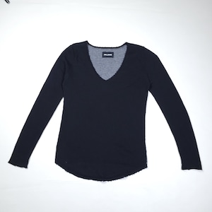 May include: A black long-sleeve shirt with a V-neck design. The shirt has a distressed neckline and hem. The brand name is visible on the neckline.
