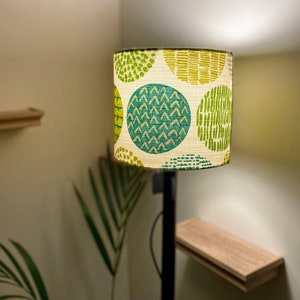 Beautiful Geometric Design. Refreshing shades of green. Add Character to any room! Drum shaped Table and ceiling Lamp shade. In 3 sizes