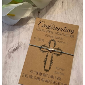 May include: Confirmation bracelet with a silver cross charm and blue string. The card reads "Confirmation I can do all things through Christ who gives me strength! Philippians 4:13 To: Joseph Blessings! Father John Put it on your wrist & make a wish! It will start to come true when it falls off of you! Alyssa Ashley Designs"