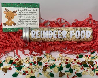 May include: A clear plastic tube filled with oats and sprinkles labeled "Reindeer Food". A small card with a poem about reindeer food is in the background.