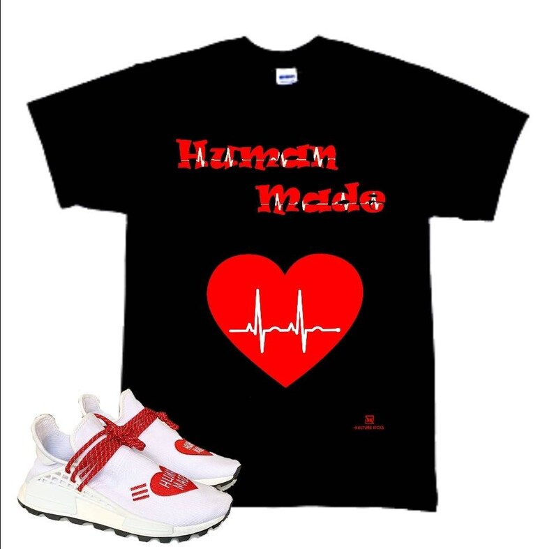May include: A black t-shirt with the words "Human Made" in red lettering and a red heart with a white EKG line. A pair of white sneakers with red laces and a red heart graphic on the side.