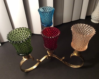 Round brass candle holder with colorful votives