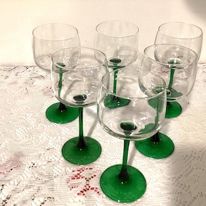 Set of 4 Luminarc Emerald Green Stemmed Wine 7 inches tall glasses marked France. Holds 8 ounces.