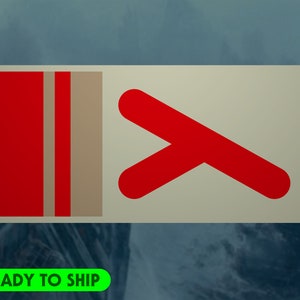 May include: A rectangular sticker with a cream background. The left side features a red vertical stripe with a tan stripe next to it. The right side has a red angled arrow. The text "READY TO SHIP" is in a green rectangle at the bottom.