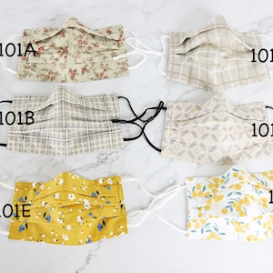 May include: Six different fabric face masks with various patterns. The masks are labeled 101A, 101B, 101C, 101D, 101E, and 101F.