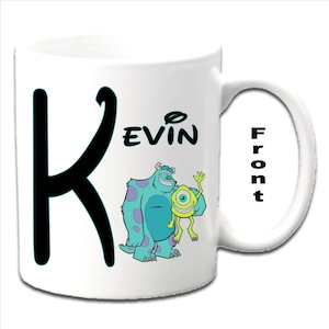 May include: White ceramic mug with a black letter K and the name "Kevin" printed on the front. The mug features a cartoon image of Sully and Mike from the movie Monsters Inc.