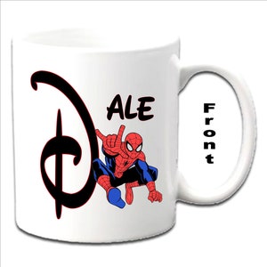 May include: White ceramic mug with a black Disney logo and a red and blue Spiderman character. The name "ALE" is written in black above the character. The word "Front" is written on the handle of the mug.