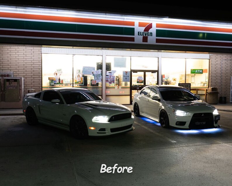 May include: Two white cars parked in front of a 7-Eleven store at night. The car on the left is a Ford Mustang and the car on the right is a Mitsubishi Lancer Evolution. Both cars have aftermarket LED lights.