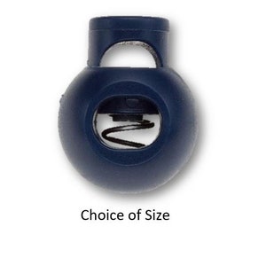 May include: A dark blue plastic toggle with a spring mechanism. The toggle has a round shape with a hole in the center.  Choice of Size.