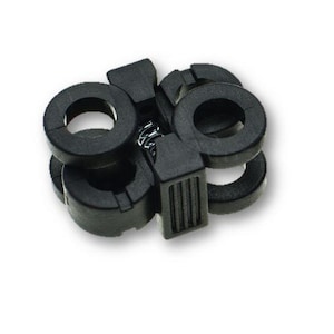 May include: Black plastic clamp with a spring mechanism. The clamp has two circular openings and a rectangular section with a ribbed design.