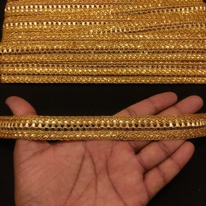 Indian Metallic Gold Ribbon Lace Trim For Decoration Of Dresses With Embellishment Border For Crafting, Sewing And Clothing Accessories.