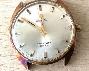 Omega Seamaster Cosmic Automatic gold toned case white dial for parts or repair only.  Ref165026