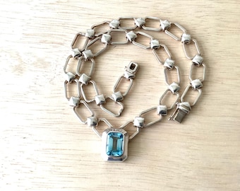 Sterling & emerald cut blue gemstone 19 inch long.   REF 3136