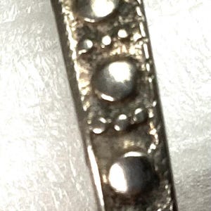 Sterling Silver stamped design bracelet 2.25 in ID. 20 grams.  Ref J1010-ab20