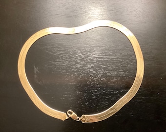 Sterling with gold tone overlay herringbone necklace 18 inches 9mm wide.  REF A18925