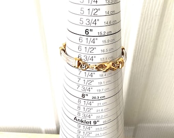 Sterling silver with gold toned 7 inch bracelet.  REF3126