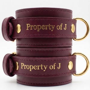 Personalized leather cuffs engraved Property of J, custom BDSM restraints with gold lettering romantic personalized couple gift.