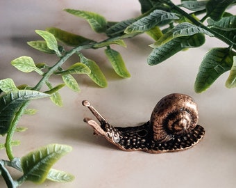 Tiny copper snail incense holder