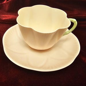 Vintage Shelley fine bone china pink pastel cup and saucer with green handle