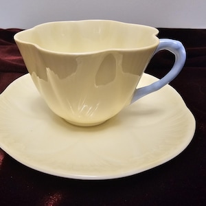 Vintage Shelley fine bone china yellow pastel cup and saucer with blue handle