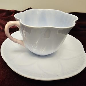 Vintage Shelley fine bone china blue pastel cup and saucer with pink handle