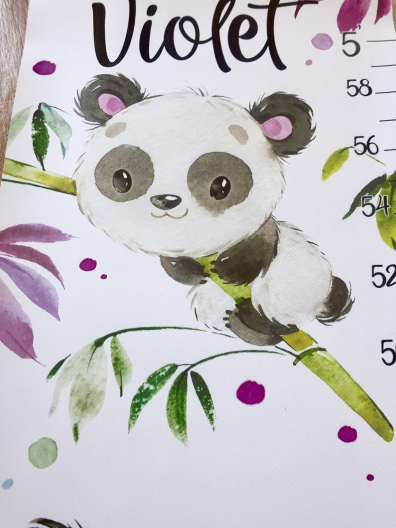 May include: A white growth chart with a panda bear holding onto a bamboo branch. The chart has purple and green watercolor accents and the name "Violet" at the top. The chart measures from 52 to 58 inches.
