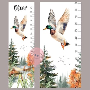 May include: A decorative height chart featuring a watercolor illustration of a flying duck over a forest scene. The chart includes measurements in inches, a name, and a nature-themed design, perfect for a child's room.