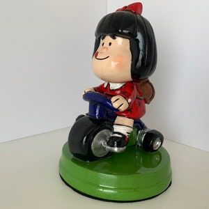 Mafalda on Tricycle / Mafalda on her Tricycle.
