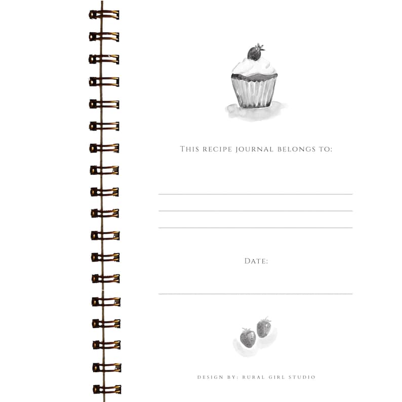 May include: A spiral-bound recipe journal with a watercolor illustration of a cupcake topped with a berry. The journal includes prompts for the owner's name and the date. The text "This recipe journal belongs to:" is printed at the top.