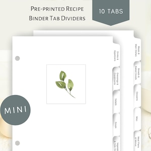 May include: A set of 10 pre-printed recipe binder tab dividers with a watercolor leaf design. The tabs are labeled with common recipe categories, such as "Meats & Main Dishes", "Breads & Baked Goods", "Desserts", "Misc.", "Meal Plans & Menus", "Drinks & Appetizers", "Dressings & Condiments", "Salads", "Soups", and "Vegetables & Side Dishes".