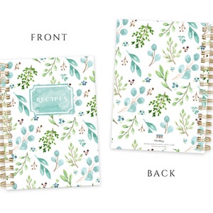 May include: A spiral-bound recipe journal with a watercolor botanical design. The cover features the word "RECIPES" in a teal frame, surrounded by green and blue leaves and flowers on a white background. The back of the journal has a similar pattern.