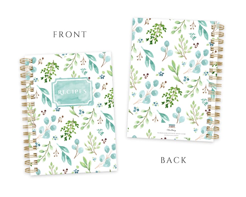 May include: A spiral-bound recipe journal with a watercolor botanical design. The cover features the word "RECIPES" in a teal frame, surrounded by green and blue leaves and flowers on a white background. The back of the journal has a similar pattern.