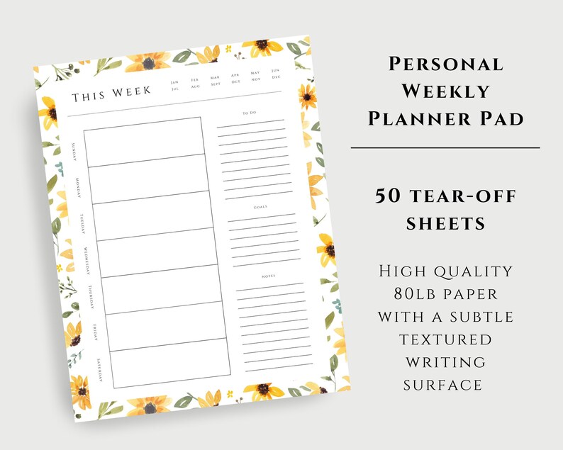 May include: A weekly planner pad with a floral design featuring yellow sunflowers and green leaves. The pad has 50 tear-off sheets and is made of high-quality 80lb paper with a subtle textured writing surface. The text "This Week" is at the top of the planner.