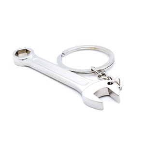 May include: A silver wrench keychain with a ring for attaching to keys.