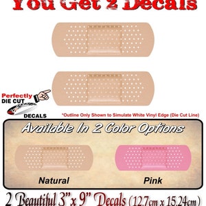 May include: Two die-cut vinyl decals of a band-aid, one in natural and one in pink. Each decal is 3 inches by 9 inches (7.62 cm x 22.86 cm). The text "You Get 2 Decals" is at the top of the image. The text "Available In 2 Color Options" is below the decals. The text "2 Beautiful 3" x 9" Decals (12.7cm x 15.24cm)" is at the bottom of the image.