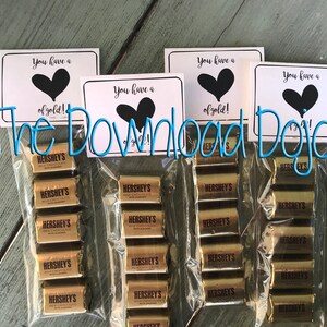 May include: Four bags of Hershey's chocolate bars with a printable tag that says "You have a heart of gold!"
