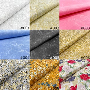 Könnte beinhalten: Neun Stoffmuster in verschiedenen Farben und Mustern. Die Muster umfassen Weiß mit Paisley-Design, goldenes Paisley, Rosa, Blau, Schwarz mit Marmoreffekt, Gold mit Sprenkelmuster, Gold und Schwarz mit kreisförmigem Muster und ein Blumenmuster. Jedes Muster ist nummeriert.