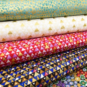 May include: Stack of five fabric swatches featuring different geometric patterns. The top swatch is teal with gold flecks, the second is white with gold triangles, the third is red with gold and purple triangles, the fourth is black with gold, blue, and brown triangles, and the bottom swatch is gold with multi-coloured circles.