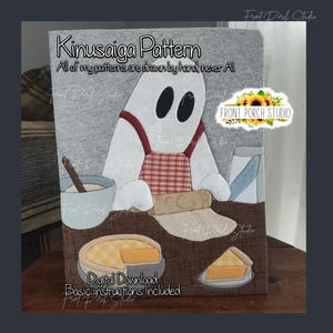 May include: A Kinusaiga pattern digital download featuring a white ghost wearing a red plaid apron, baking with a bowl, rolling pin, and pie. The text reads Kinusaiga Pattern, All of my patterns are drawn by hand never AI, and Digital Download Basic instructions included.