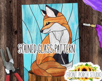 May include: Stained glass pattern of a fox sitting on a tree stump. The fox is orange, white, and black. The background is blue and white.